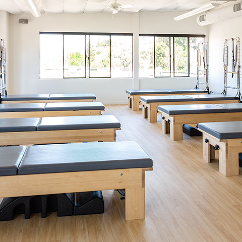 The studio's reformer room, set up for a class