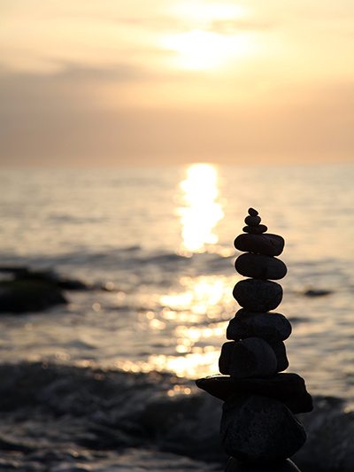 rocks balance with beach sunset