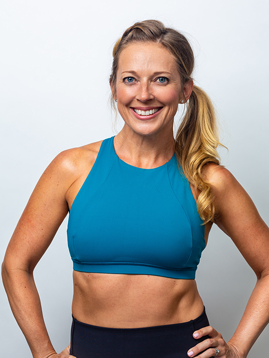 Studio Flo Pilates Instructor Jenn Brady in a blue top
