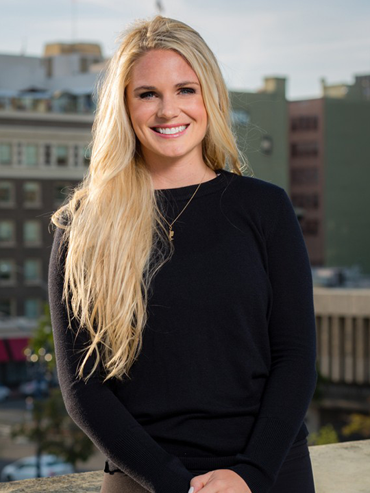 Studio Flo Pilates Instructor Kaitlyn Bradley in a black outfit