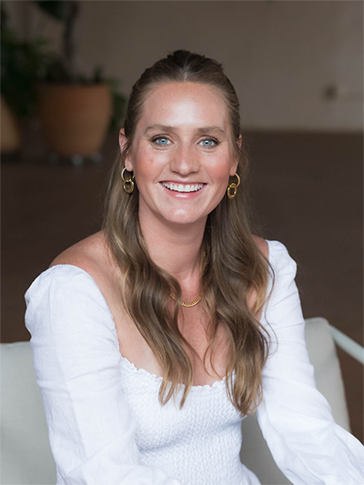 Studio Flo Pilates Instructor Kristen Karlin in a white outfit